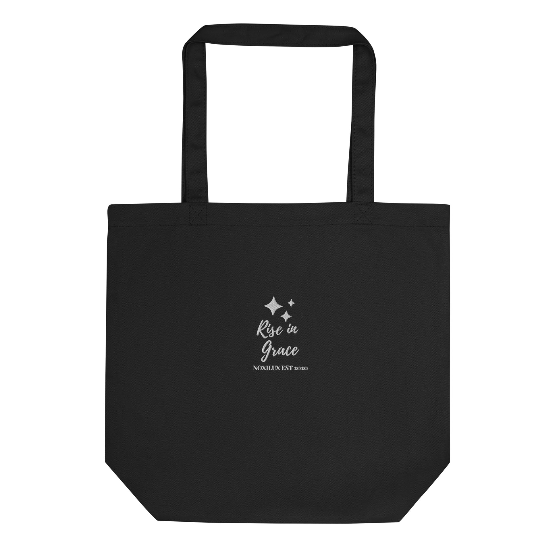 Black  shopping tote bag with 'rise in grace.' text and a sparkle symbol on a white embroidered. Eco-friendly organic cotton.